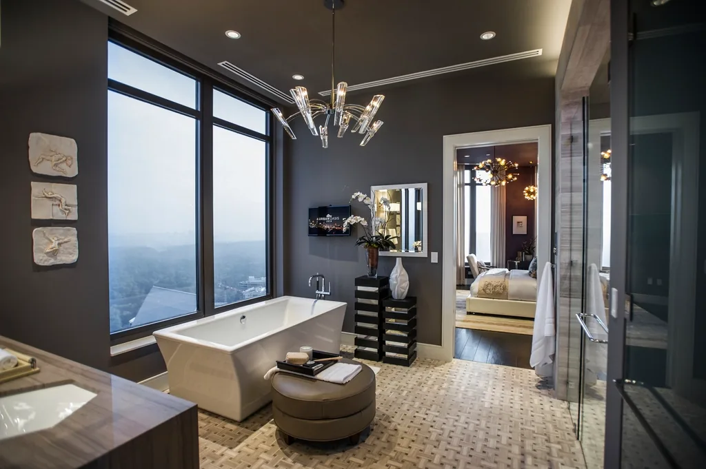 Bathroom with a freestanding tub and large windows