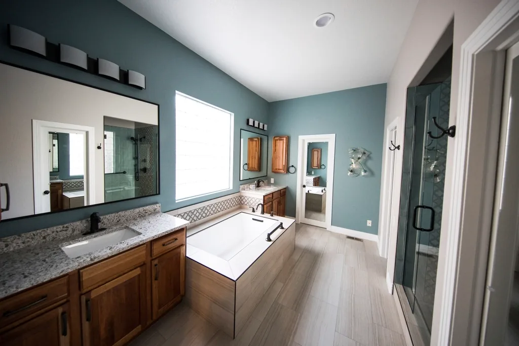 Bathroom with a wood vanity and a soaking tub